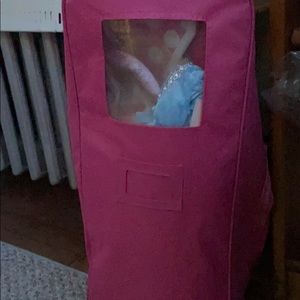 AGD carrier and some doll clothes with a bed